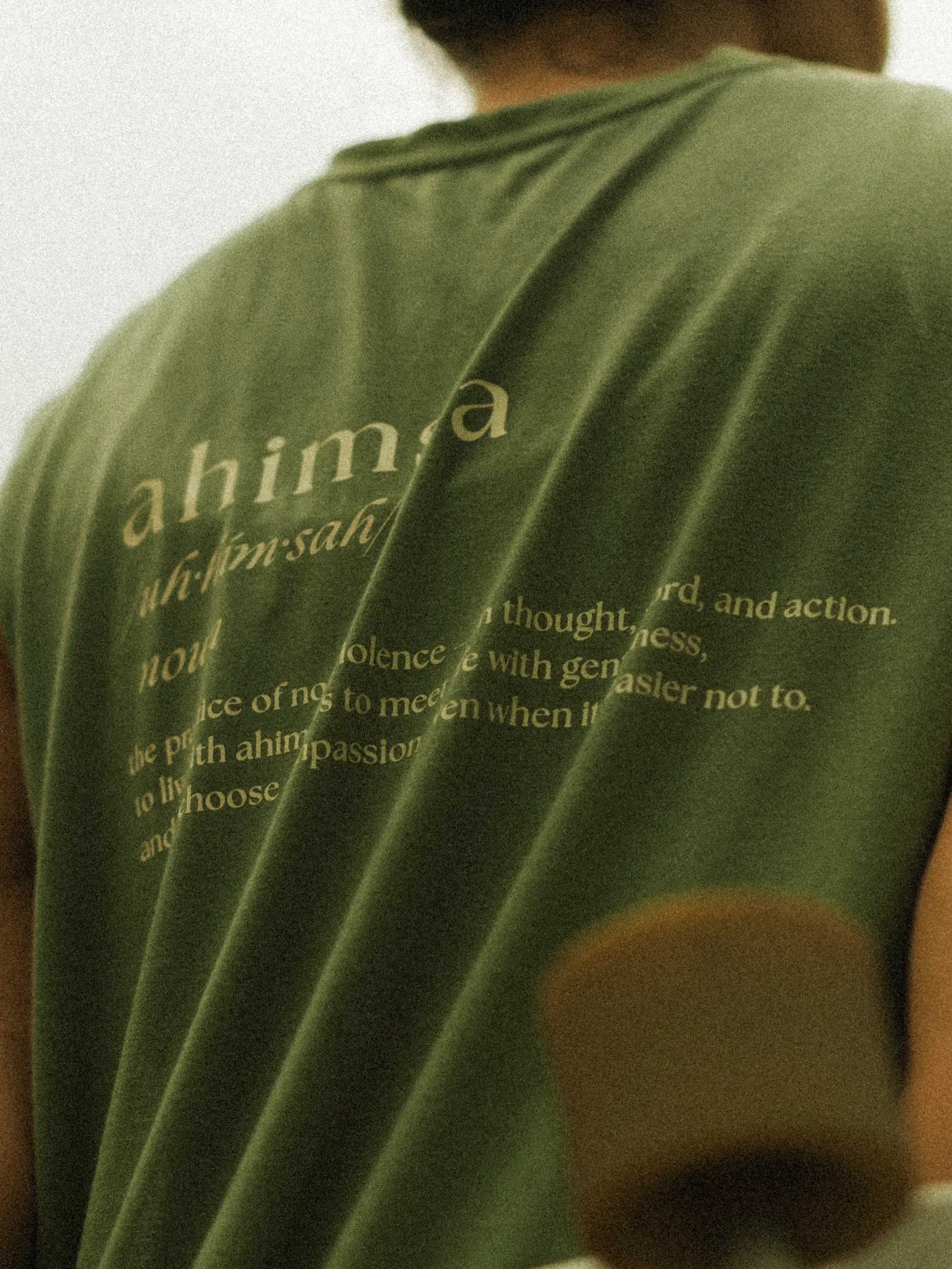 A shirt reading ahimsa — the practice of non-violence