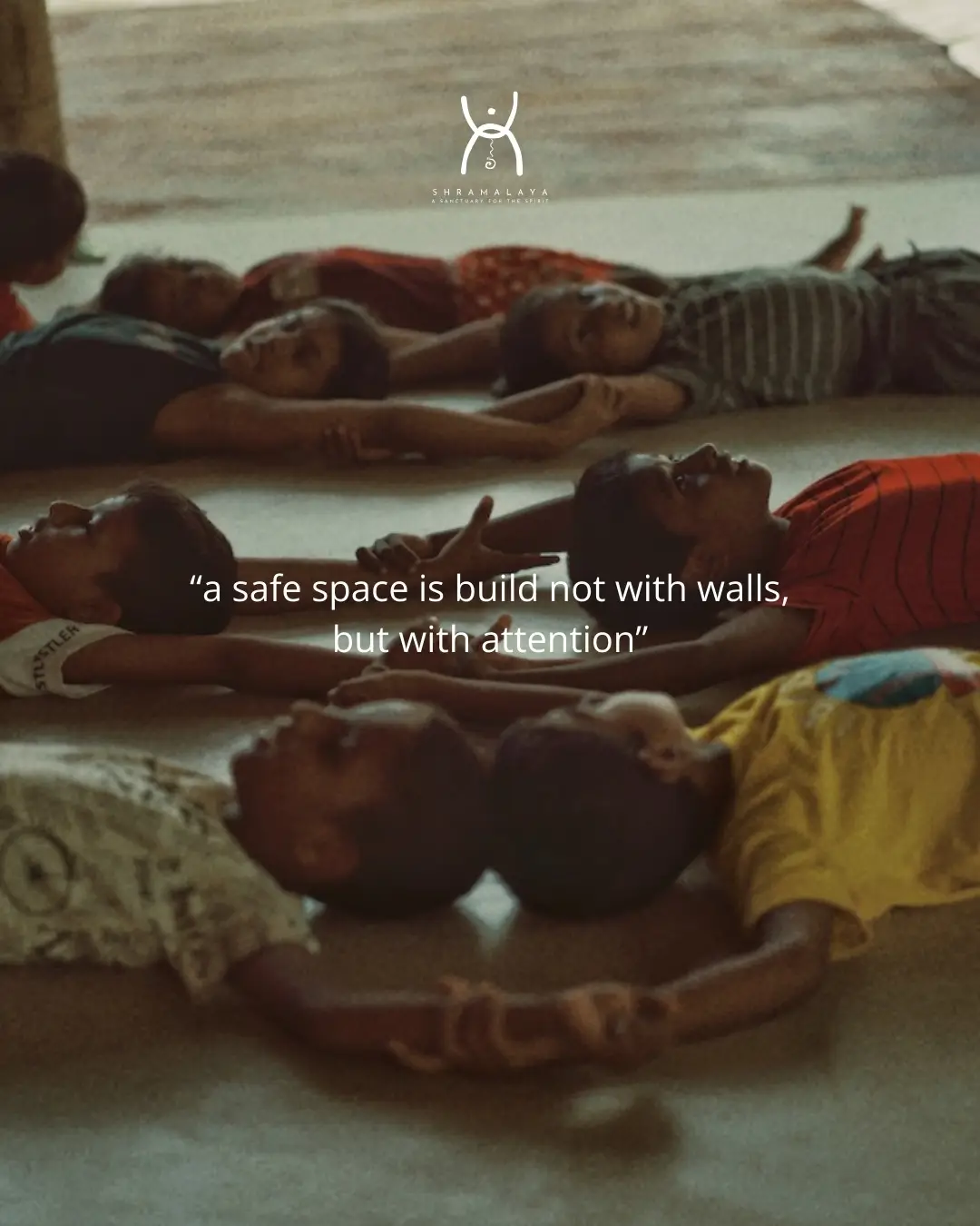 Children from the village resting together on the shala floor